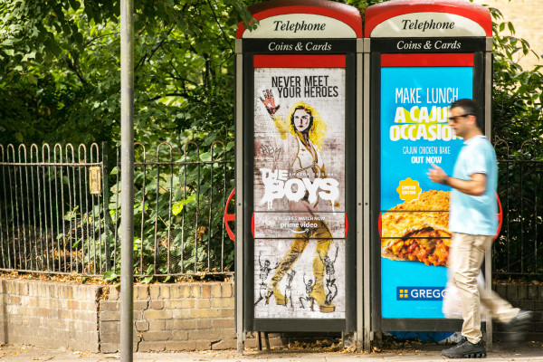 Advertising panels displayed on two London telephone boxes